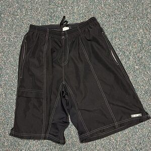 CANARI size large men’s black bike shorts. Side pockets on both sides. Padded.